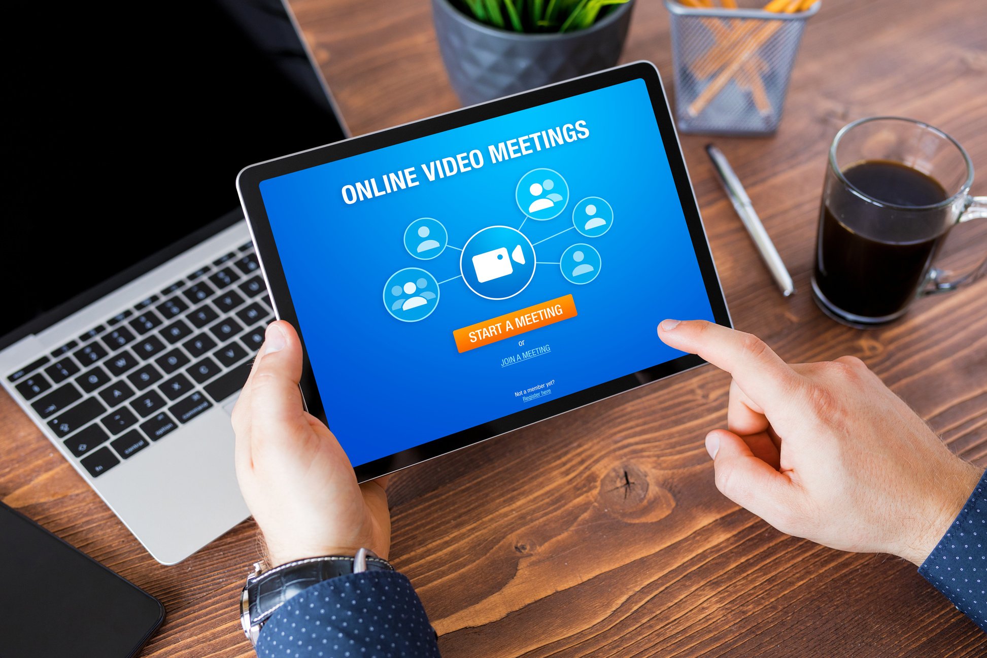 Man Using Online Video Meeting App on Tablet